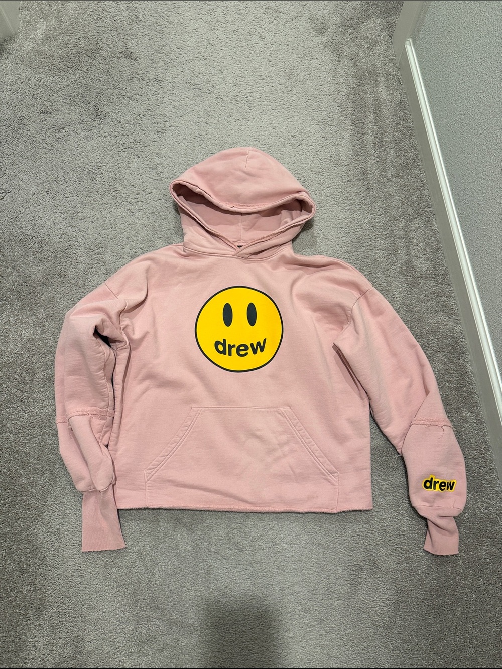 DREW Pink Hoodie with Yellow Smiley Logo